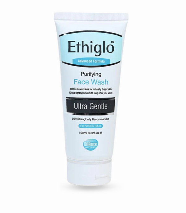 "Ethiglo Purifying Face Wash in a tube with miliglobules visible in the cream."