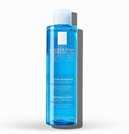 Clear, liquid La Roche-Posay soothing toner on a cotton pad
